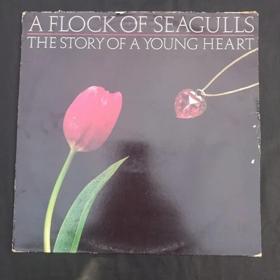 A FLOCK OF SEAGULLS- THE STORY OF A YOUNG HEART- VINYL LP HIP A1 B1  EXC VINYL  - Image 1 of 4