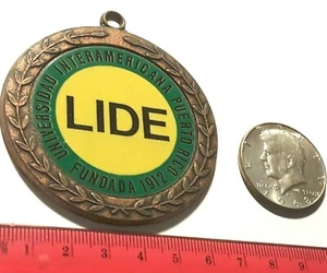 UNIVERSIDAD INTERAMERICANA PUERTO RICO COMPETENCIAS LIDERA ficha medalla - Imagen 1 de 4
