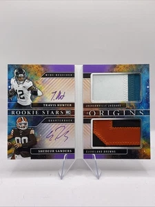 2025 Panini Origins Travis Hunter Shedeur Saunders Dual Auto RPA Booklet #/23 - Picture 1 of 6