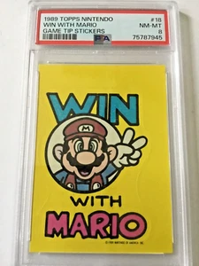 Adesivi Topps Nintendo Game Tip 1989 #18 Vincere con Mario PSA 8 - Foto 1 di 5
