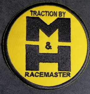 Parche bordado Traction by M&H Racemaster envío a todo el mundo aprox 3,5" - Imagen 1 de 2