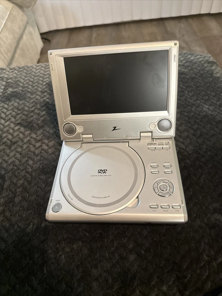 Reproductor de DVD portátil Polaroid (7")*SIN PROBAR/(SIN CONTROL REMOTO/SIN CARGADOR Foto 1 de 4