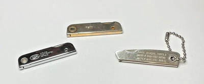 Lot of 3 Vtg Trim Trio Style Pocket Knives/Tools Bassett Gold Tone 76 Bandag 85 - Image 1 of 4