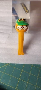 PEZ Garfield with visor - orange stem - Loose - china - Picture 1 of 2