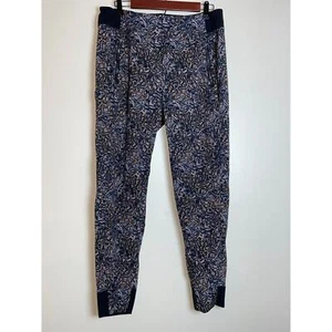 Pantalones de chándal Athleta Trekkie North - para mujer talla 12 - negros cinéticos abstractos - Imagen 1 de 12