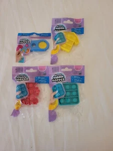¡Juego de 4 poppers de burbujas variedad orbe de 4 BNIP! - Imagen 1 de 6