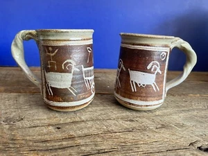 STUDIO ART POTTERY MUGS TRIBAL CAVEMEN ART TWISTED HANDLE ARTIST SIGNED - Picture 1 of 8