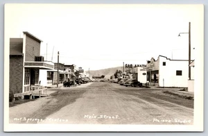 Main Street Hot Springs Montana MT tiendas de autos antiguos c1940 foto real RPPC - Imagen 1 de 2
