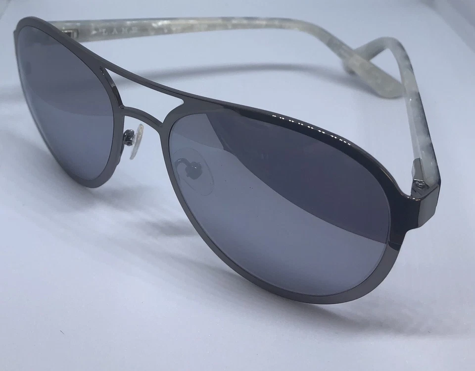 Gafas de sol L.A.M.B con marco plateado y hielo LA556 55-18-140 B:48 lentes espejadas grises Foto 1 de 4