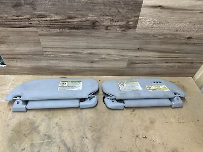 2005-2006 Ford Expedition Left & Right Sun Visor Set Pair Grey - Image 1 of 4