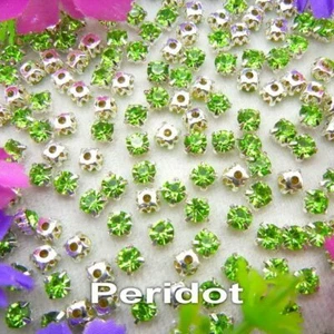 10 x 8mm PERIDOT STRASS CRYSTAL SILVER BASE SEW ON GEMS WEDDING COSTUMES CRAFTS - Picture 1 of 1