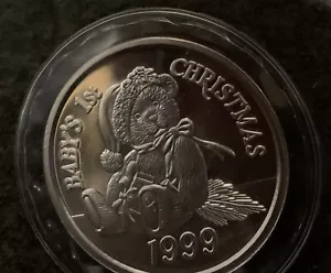 Y2K Baby 1st Christmas 1999 1 Troy Oz Fine Silver Round Coin Minty - Picture 1 of 3