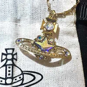 Vivienne Westwood Astrid Shooting Star Orb Planet Gold Necklace New in box - Picture 1 of 7