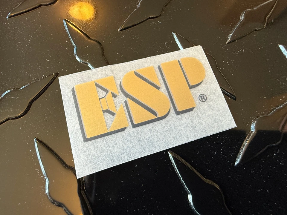 Adesivo ESP dourado com sombra preta para esfregar a seco - Imagem 1 de 3