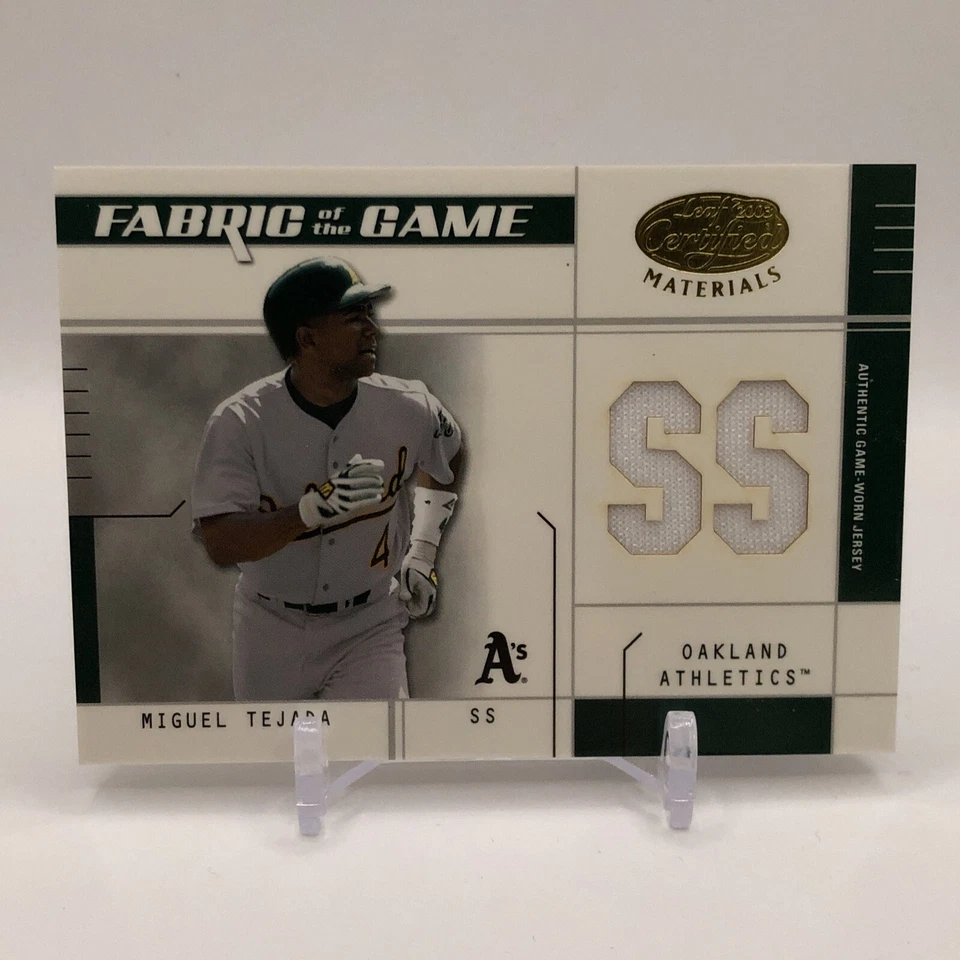 2003 Leaf Certified Materials Fabric of the Game Miguel Tejada Jersey A'S #/50 - Image 1 of 4