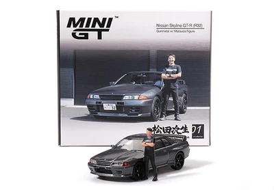 Mini-GT 1:64 NISSAN SKYLINE GT-R (R32) NISMO GUNMETAL WITH TSUGIO MATSUDA 1992 - Immagine 1 di 4