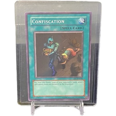 Confiscation Super Rare 25th Anniversary Yu-Gi-Oh! Card #SRL-EN038 W/ Top Loader - Image 1 of 3