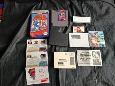 ОВАЛЬНАЯ ПЕЧАТЬ MEGA MAN 2 NES В КОМПЛЕКТЕ С РЕДКИМ РУКОВОДСТВОМ И ВСТАВКАМИ MEGA MAN 2 НАКЛЕЙКИ - Изображение 1 из 4