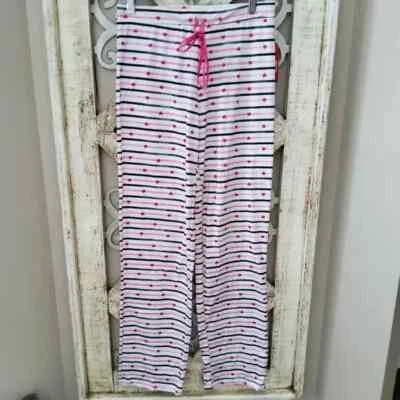 Pantalones de pijama Rampage para mujer con cordón brillante cintura elástica corazones Foto 1 de 4