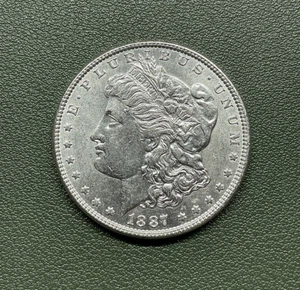 1887 Morgan Silver Dollar, BRILLIANT UNCIRCULATED -FREE SHIPPING-M-114 - Picture 1 of 2