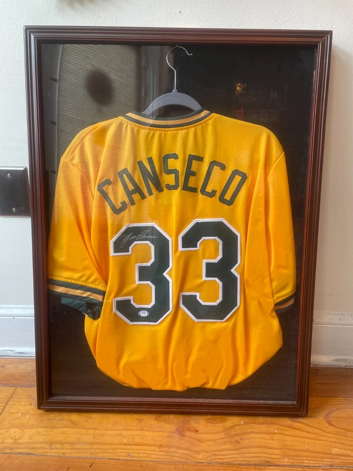 Jose Canseco Signed Jersey XL Yellow A's - Image 1 of 1