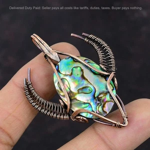 Joyería colgante con forma de cara de toro envuelta en alambre de esposa con concha de abulón de cobre - Imagen 1 de 6