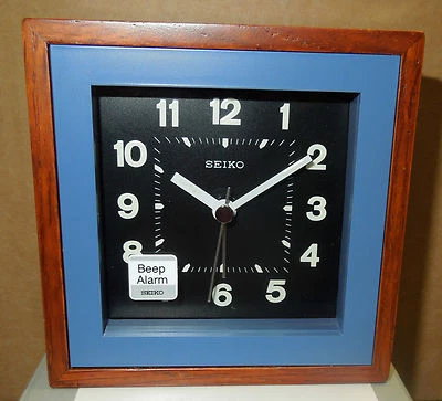 SEIKO -  SQUARE  WOOD TRIM WITH BLUE SURROUND BEEP ALARM CLOCK QXE047LLH - Image 1 of 3