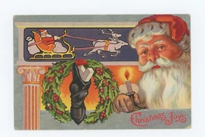 Christmas Joys ~ SANTA CLAUS HOLDING A CANDLE ~ Embossed Antique c.1909 Postcard - Imagen 1 de 2