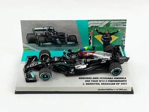 Mercedes F1 W12 #44 Lewis Hamilton Brazil 2021 Winner with Flag 1:43 MINICHAMPS - Picture 1 of 8