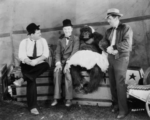 Stan Laurel and Oliver Hardy with producer Hal Roach during filmin- Old Photo - Picture 1 of 1