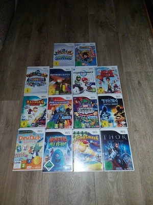 Konvolut 14x Nintendo Wii Spiele Sammlung  Mario Kart, Rayman Gebraucht Okay-Gut - Bild 1 von 4