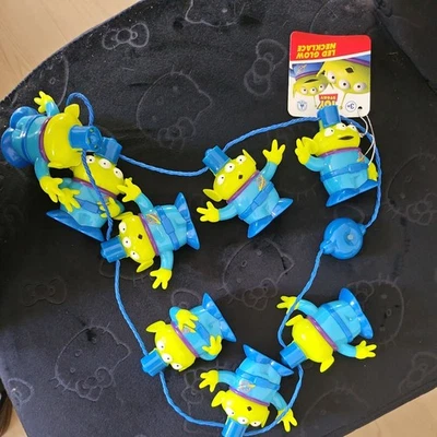 Collar resplandor LED alienígena pequeño verde Toy Story de los parques de Disney Foto 1 de 4