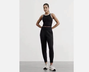 Pantalones de chándal negros de tiro medio ATHLETA Venice bolsillos elásticos salón talla mediana - Imagen 1 de 11