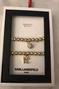 Karl Lagerfeld Paris 2PC Gold Tone Bead Stretch Bracelet Set With Charm NIB - Picture 1 of 14