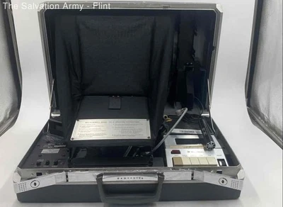 Proyector vintage Bell & Howell 1152-D Communicator/50 tira de película de sonido Foto 1 de 4