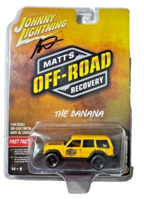 Johnny Lightning Matt's Off-Road Recovery Cherokee XJ The Banana 1:64 Autograph Foto 1 de 4
