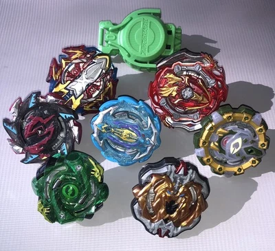 BEYBLADE Takara Tomy Slingshock Burst Metal Lote De 7 Tops Discos Puntas con Lanzador Foto 1 de 2