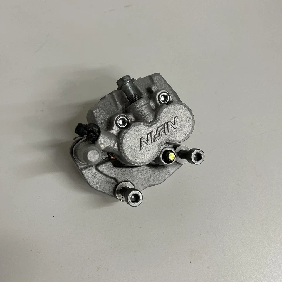 Kawasaki KX125 KX 125 1992 pinza de freno delantera reconstruida con pastillas nuevas OEM  Foto 1 de 4