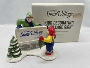 DEPT 56 SNOW VILLAGE "KIDS DECORATING THE VILLAGE SIGN" RETIRED- - Picture 1 of 6