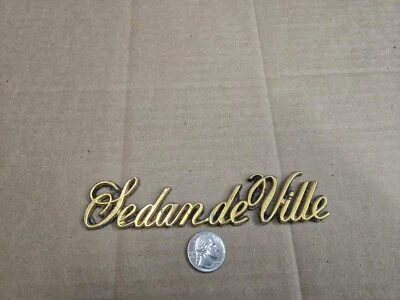 Cadillac OEM 1970-1980 Sedán deVille Cromo Emblema Insignia Logo Placa de identificación Nombre Foto 1 de 4