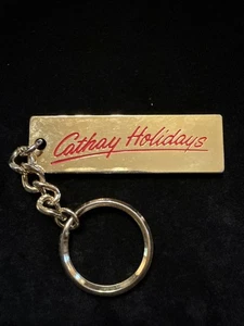 Cathay Holidays Keychain Hong Kong Singapore Thailand Goldtone (Lot# 486) - Picture 1 of 4