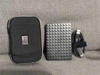 Seagate Expansion Portable 4TB Storage HDD Model 1TEAPF-500 w/ WD Zipper Case - Image 1 of 3