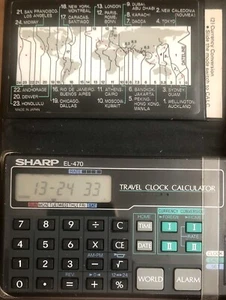 Reloj despertador de viaje Sharp EL-470 y calculadora de divisas instrucciones en billetera - Imagen 1 de 1