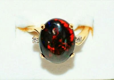 Anillo de oro amarillo de 14 quilates de 3,36 quilates de ópalo negro etíope natural y diamantes Foto 1 de 4