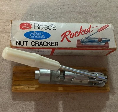 Good Condition Vintage Reeds Rocket Nut Cracker With White Handle Made In USA - Image 1 of 4