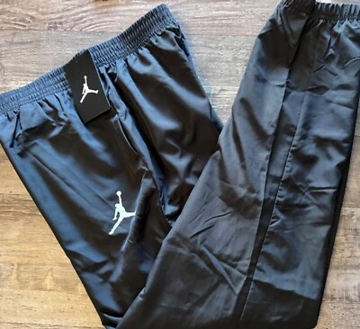 Nuevo con etiquetas Nike Air Jordan Niños YXL Negro/Blanco Suave Puño Elástico Pantalones de Viento XL Foto 1 de 2