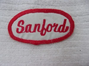 SANFORD USED EMBROIDERED SEW ON NAME PATCH TAG OVAL RED ON WHITE - Bild 1 von 1