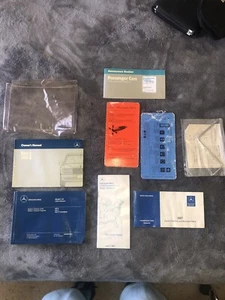 1987 MERCEDES BENZ 260E 300E OWNERS MANUAL SET COMPLETE…INCLUDING CRANK FOR ROOF - Picture 1 of 13