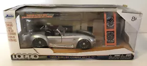 Jada Toys LOPRO 1965 Shelby Cobra 427 S/C 1:24 argento nero portapneumatici extra nuovo con scatola - Foto 1 di 9