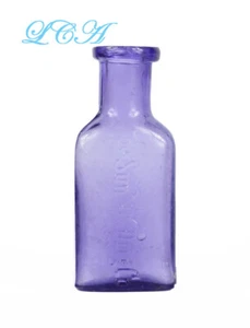 PEQUEÑA botella púrpura 1/2 OZ antigua SUN DRUG Co con foto MORTERO MORTERO ¡con ALAS! - Imagen 1 de 3